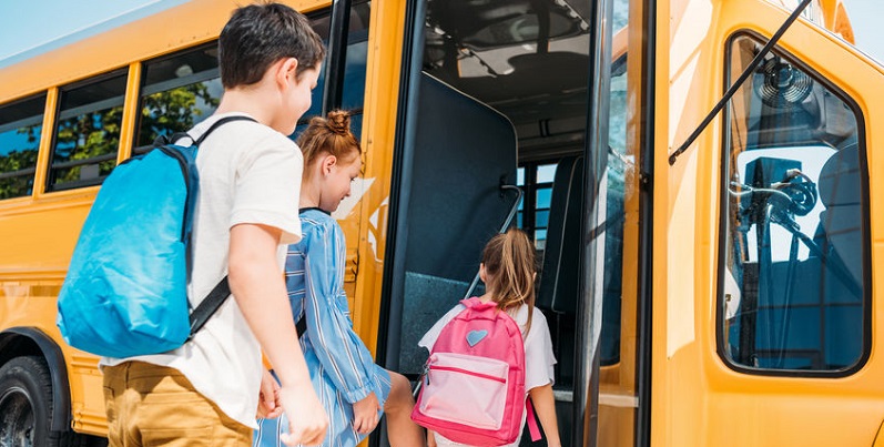 Children Getting on School Bus